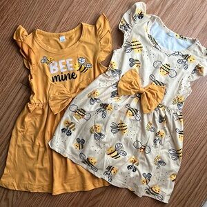 2 adorable brand new “bee” dresses